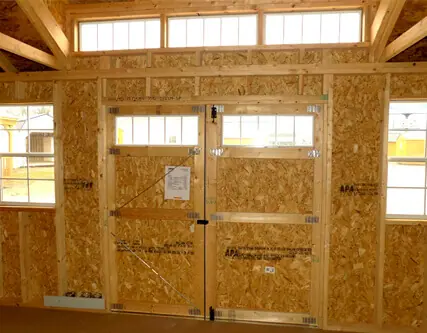 Dormer shed interior with barn doors